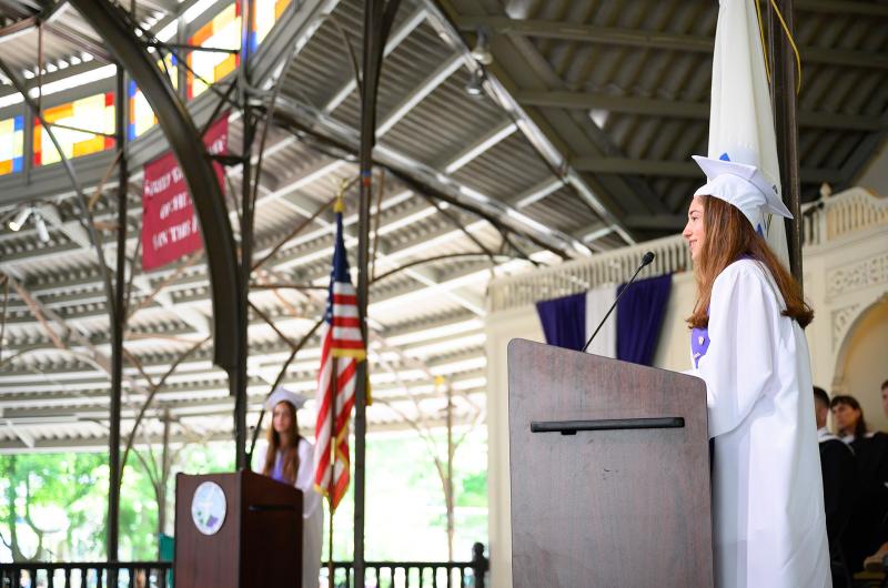 Avery Mulvey (right) delivers her speech.