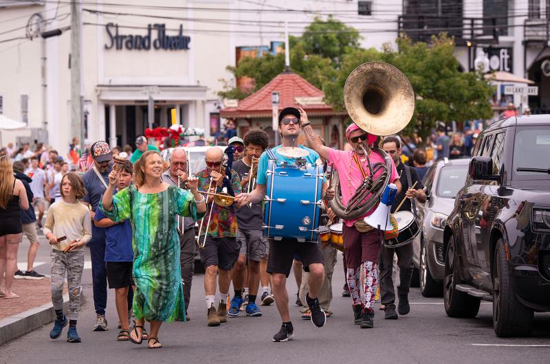 The Upisland Band leads the way up Circuit avenue.