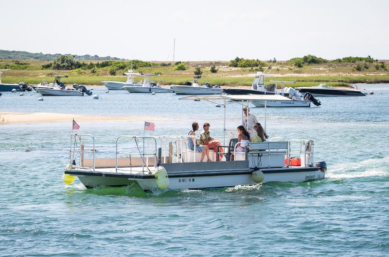 The Menemsha bike ferry goes from Menemsha harbor near the Galley to the landing in West Basin.