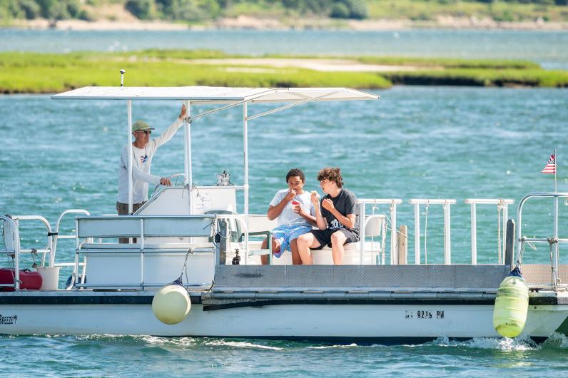 Sean McGowan brings Leo Russell and Luca Rotondi across on the bike ferry.
