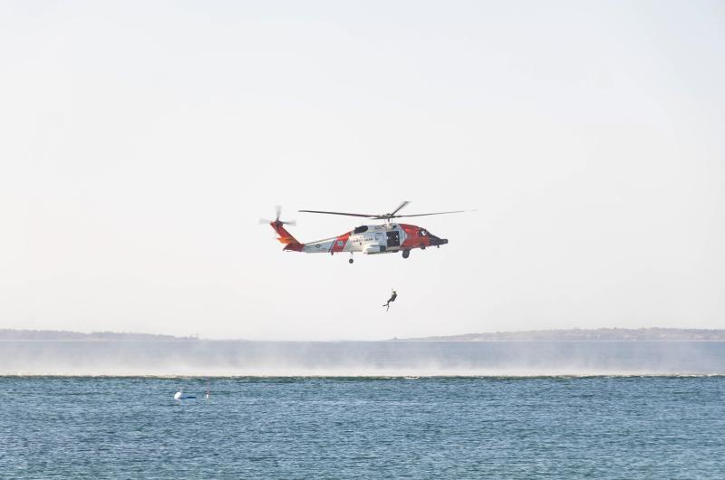 The Coast Guard performs an aquatic rescue demonstration.