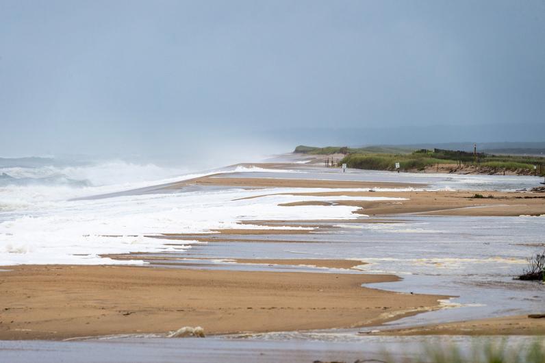 Strong surf drives erosion on the shore.