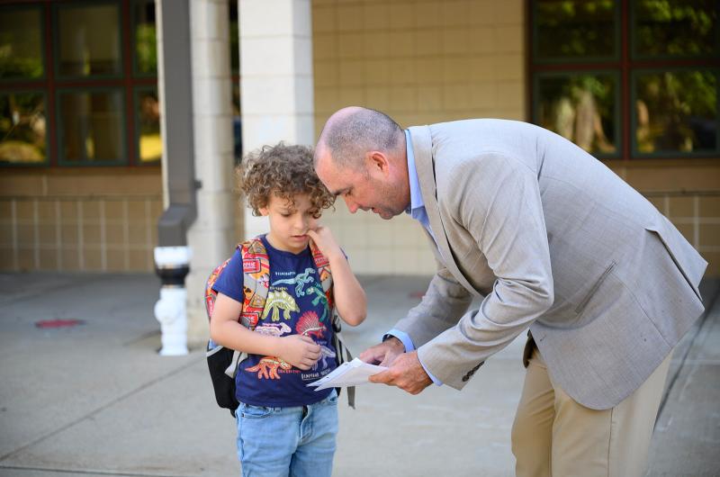 Oak Bluffs principal Jeremy Light helps a young student.