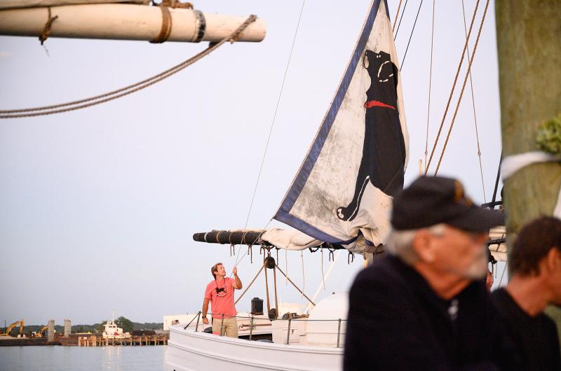 A black dog sail in unfurled on the Alabama.