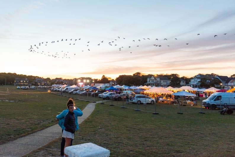 The sun sets on the festival grounds.