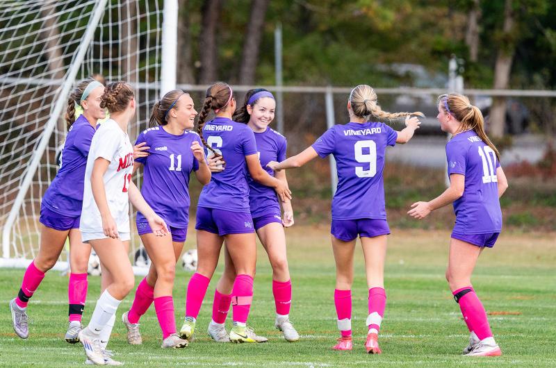Ava Townes celebrates a goal with her teammates.