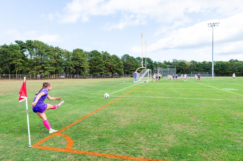 Vineyard player takes a corner kick.