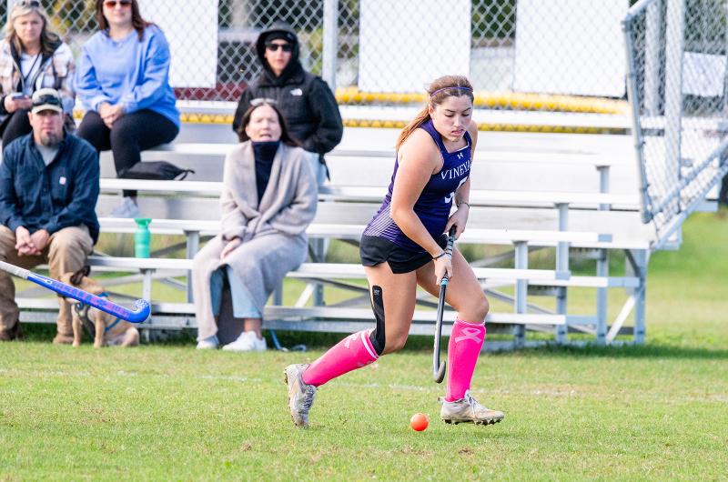 Advancing down the field.