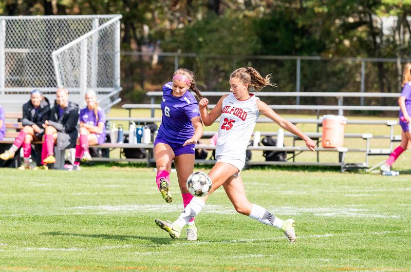 Reese Malowski sneaks it by the defender.