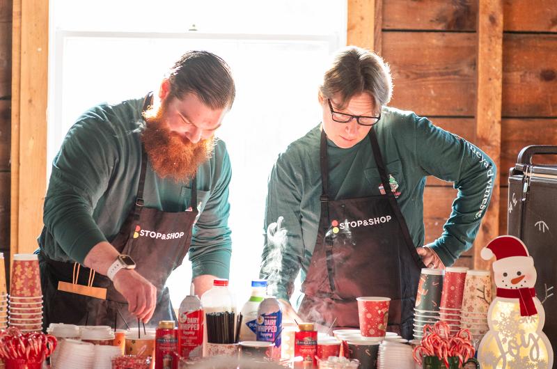 Jonathan Foster and Heather Van Murphy from Stop & Shop making hot cocoa.