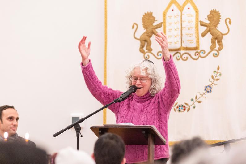 Rabbi Caryn Broitman leads the song.