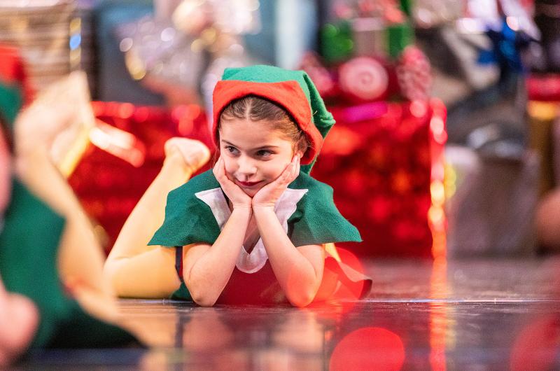 Christmas elves watch on.
