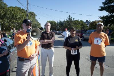 man with megaphone starts the race