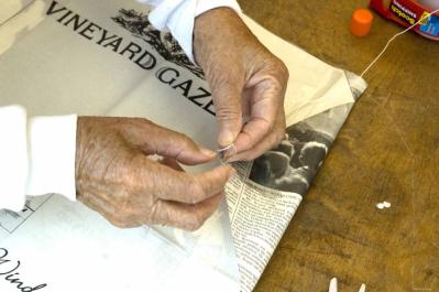 hands newspaper kite Vineyard Gazette