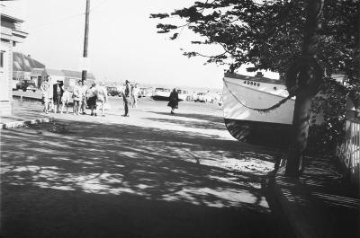 Hurricane Carol casts boats up on land. 