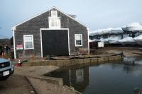 On March 11 work crews began lifting the old boat shop.