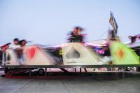 Rides spin and riders ride into the night.