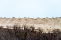 Piles of new sand placed along the entrance to Norton Point.