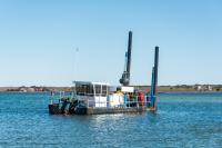 Dredge in Edgartown Great Pond.