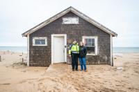 Joel DeRoche and Becky Donnelly in front of the Donnelly house.