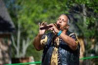 Carole Vandall gives thanks and plays the flute.