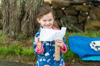Harlow Rose Sullivan with a homemade sign for her dad.