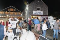 Participants line up on Saturday night to weigh in Albies.