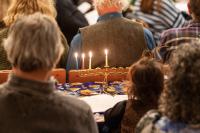 Members of The MV Hebrew Center gather for the third night of Hanukkah.