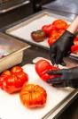 Cutting heirloom tomatoes from Morning Glory farm.