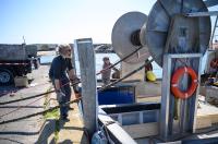 Loading the gear onto the net reel.