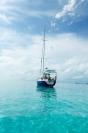 Lúthien anchored in a tropical bay.