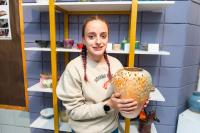 Isabella Burns with her pottery piece.
