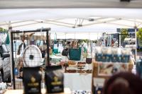 Vendors line the street selling art and crafts.