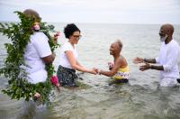 Dr. Frances Gaskin getting into the water with the help of Knowhere Art Gallery owner Valerie Francis.