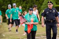The parade always makes a stop in the cemetery to pay its respects.