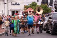 The Upisland Band leads the way up Circuit avenue.