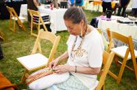 Marlene Lopez working on one of her weavings.