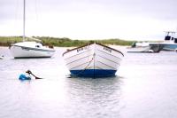A dinghy awaits the next trip.