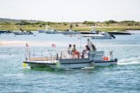 The Menemsha bike ferry goes from Menemsha harbor near the Galley to the landing in West Basin.