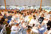 A packed house under the tent.