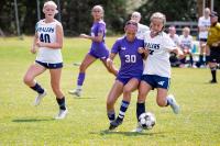 Elizabeth Carbon (center) battles it out.